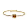 Bangle in metallo dorato e strass con gemma arancione