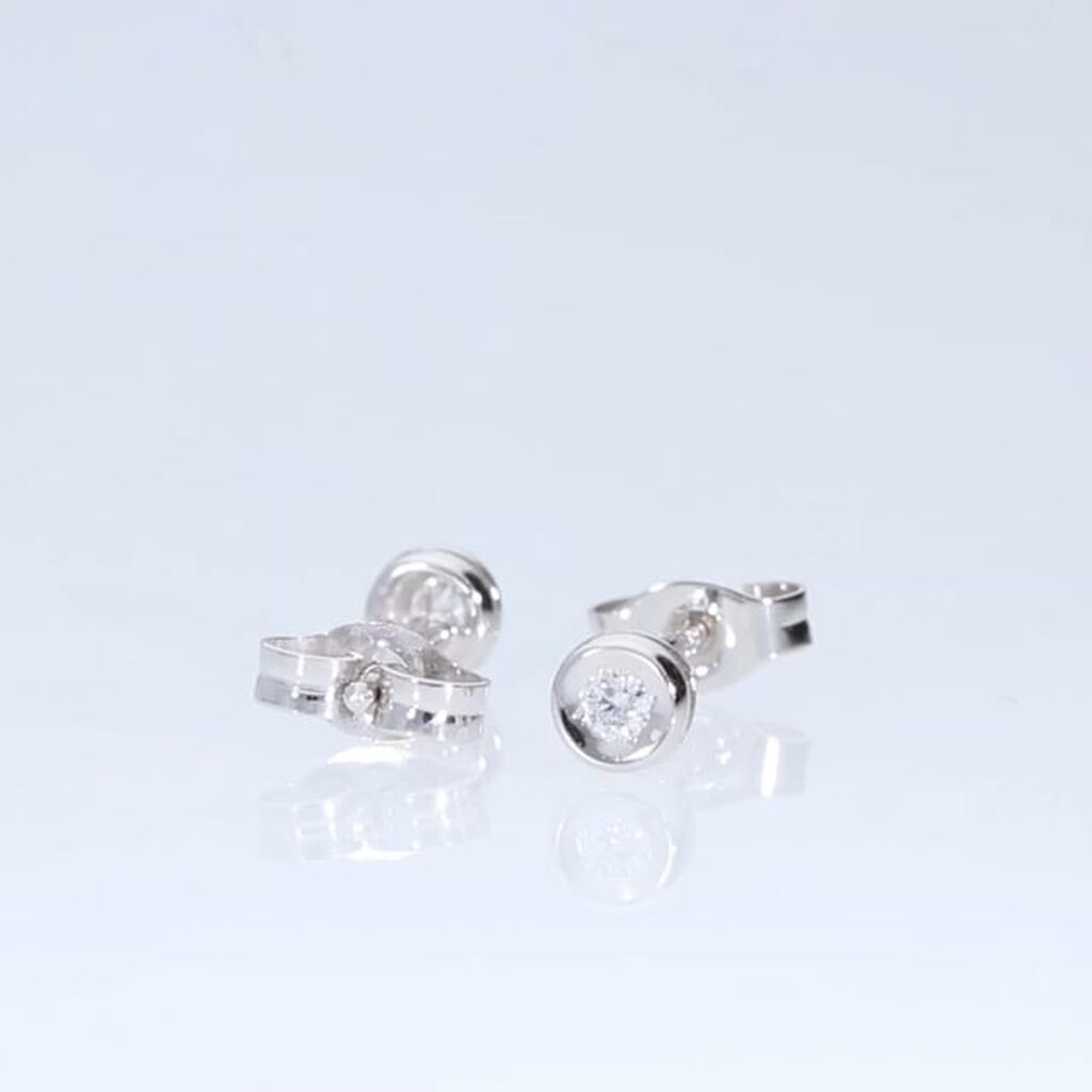 Orecchini lobo punto luce in oro bianco e brillante 0.06 ct